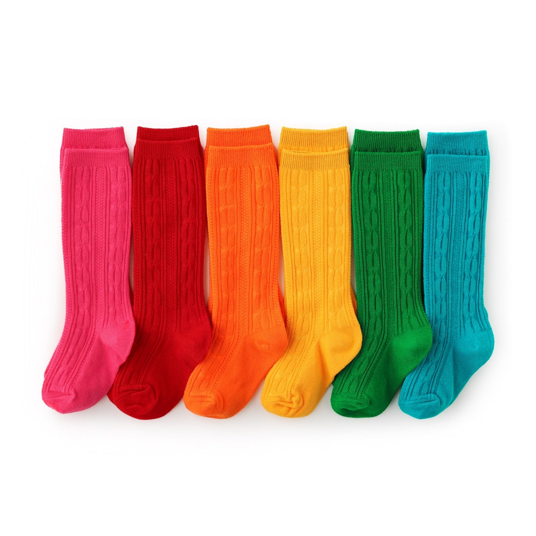 Little Stocking Co. brights cable knit bundle against white backdrop