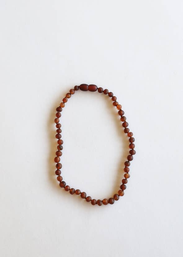 CanyonLeaf Raw Cognac amber necklace against white backdrop