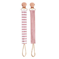 Ritzy Itzy Clip pink linen pacifier straps against white backdrop