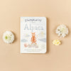 Slumberkins Alpaca Board Book against beige backdrop