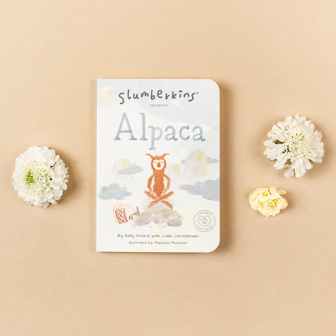 Slumberkins Alpaca Board Book against beige backdrop