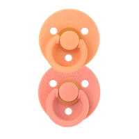 Itzy Ritzy apricot and terracotta itzy soother natural rubber pacifier set against white backdrop