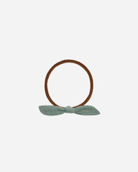 Rylee + Cru aqua shade 2 little knot headband against white backdrop