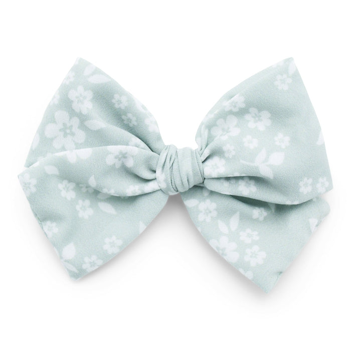The Kindred studio blue floral midi bow against white backdrop