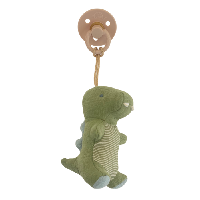 Itzy Ritzy Dino Bitzy Pals Natural rubber pacifier and stuffed animal against white backdrop