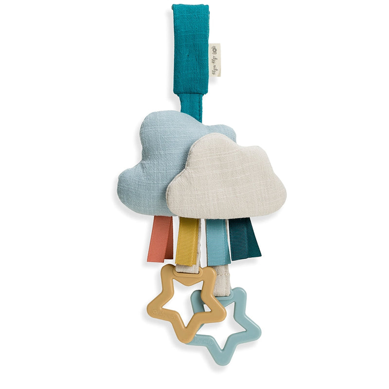 Itzy Ritzy cloud ritzy jingle attachable travel toy against white backdrop