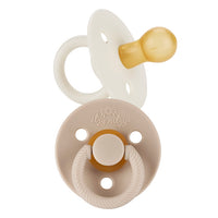 Itzy Ritzy neutral itzy soother natural rubber pacifier set against white backdrop