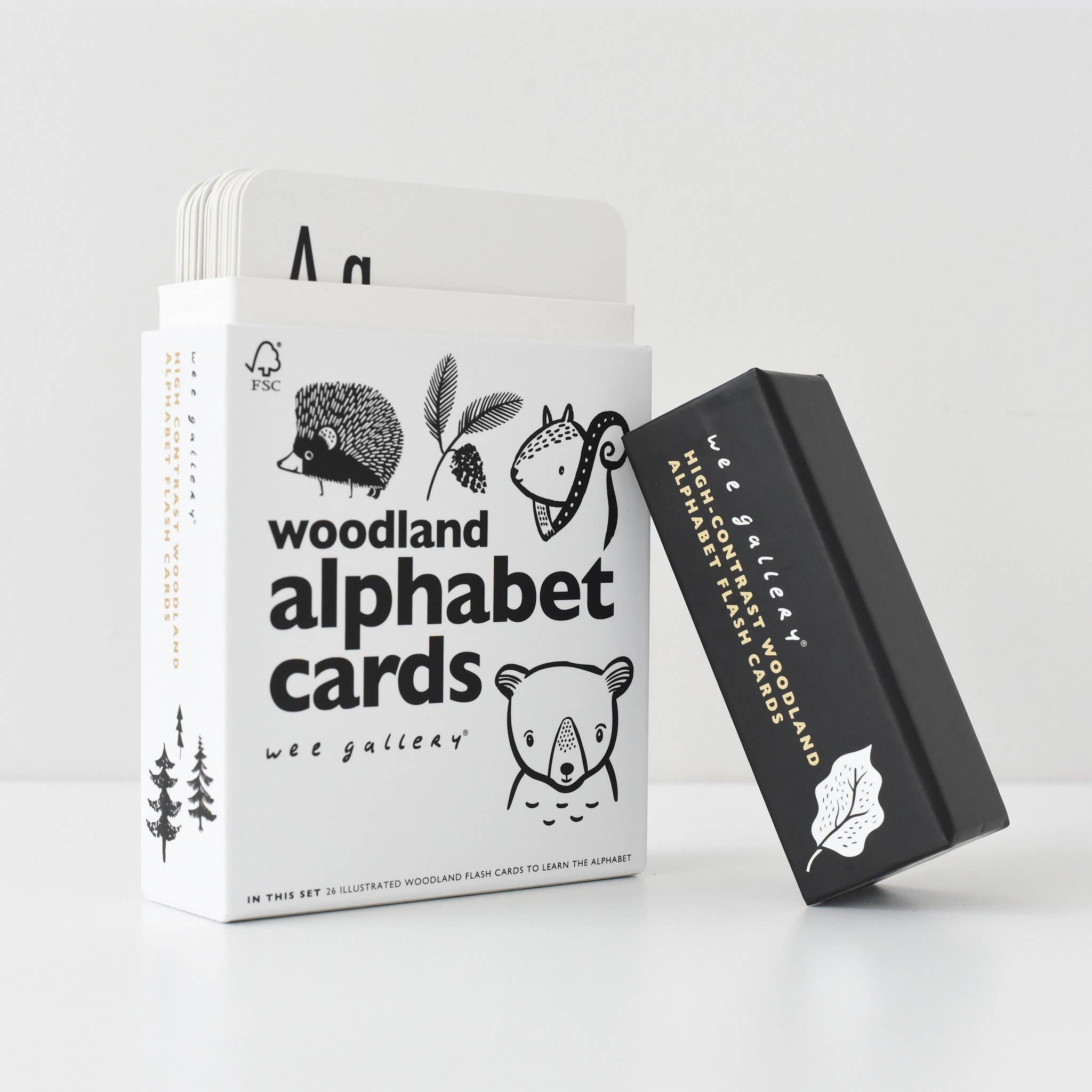 Wee Gallery woodland alphabet cards against white backdrop