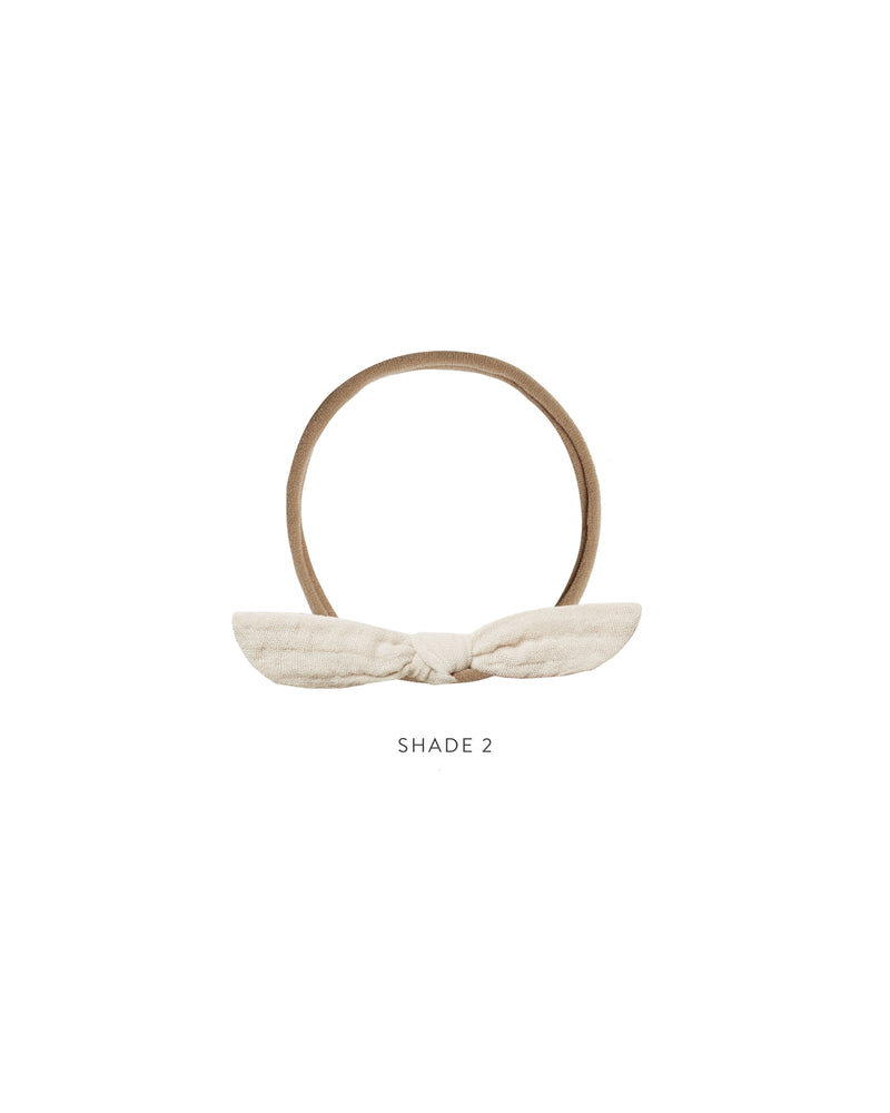 Rylee + Cru ivory shade 2 little knot headbands against white backdrop