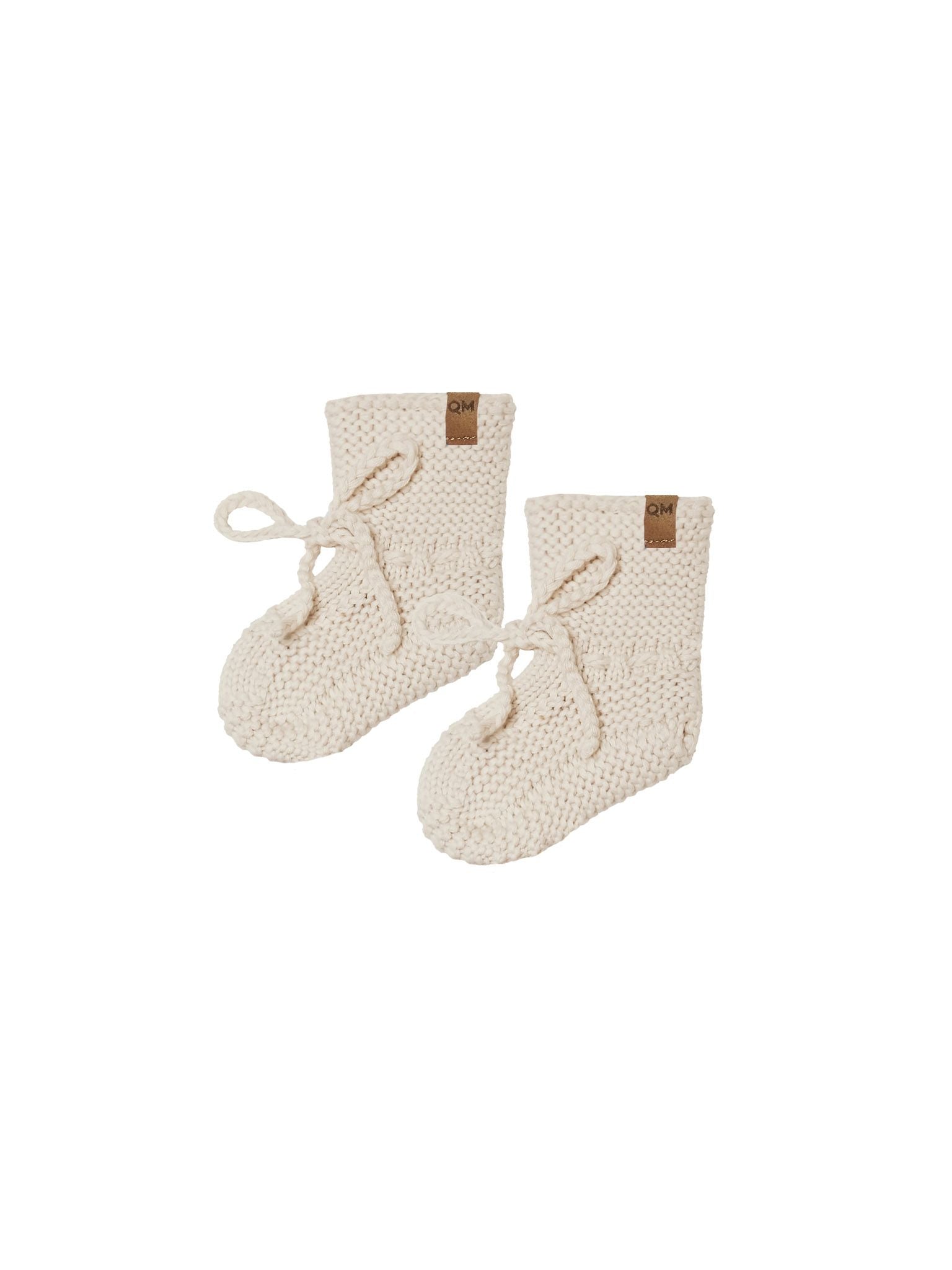 Quincy Mae natural knit booties against white backdrop
