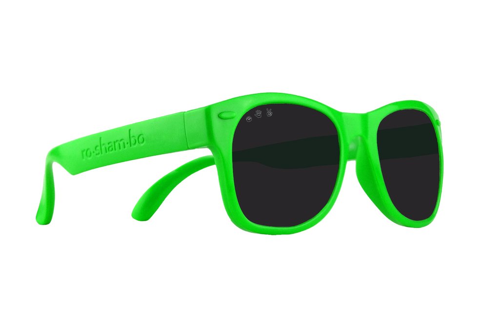 Roshambo Baby bright green sun glasses with black lens against white backdrop